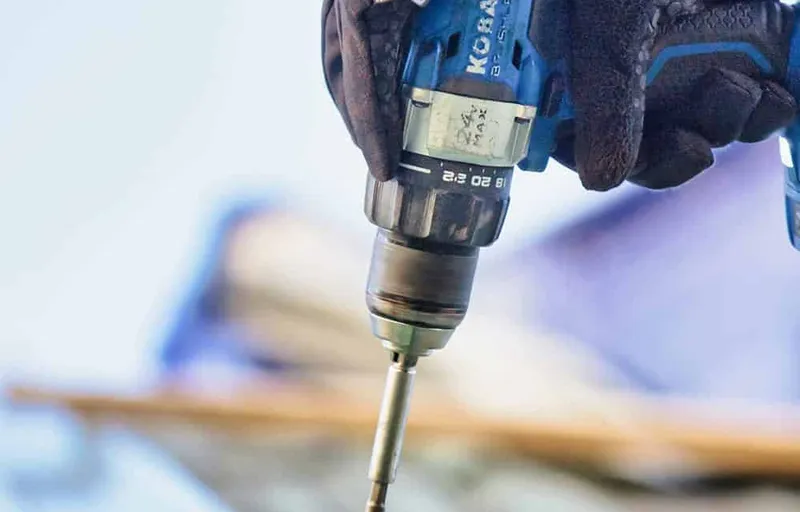 services-2 Fastening a metal roof panel during a repair
